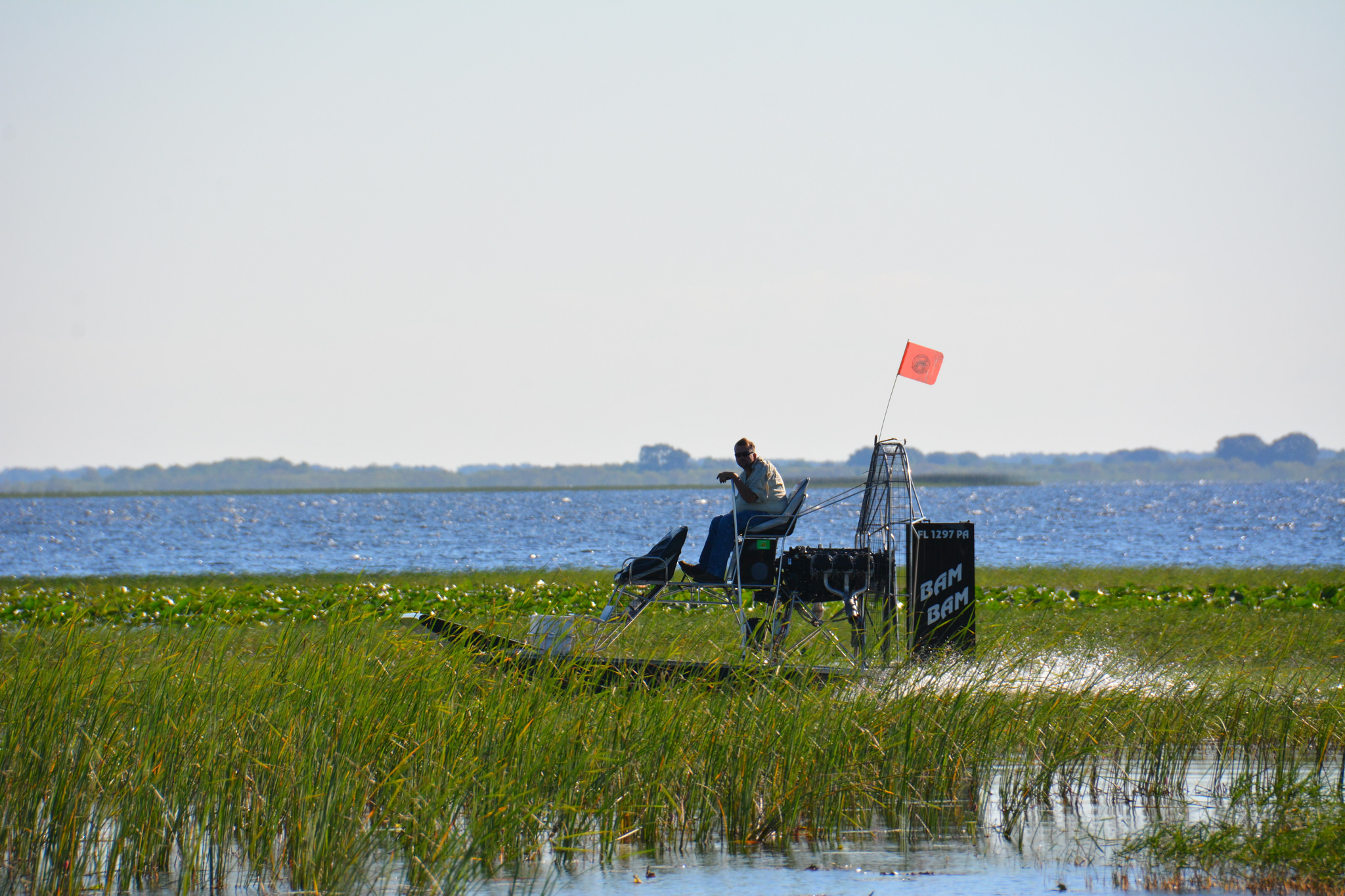A Sportman on his airboat, proudly flying the KRVSA branded visibility flag.